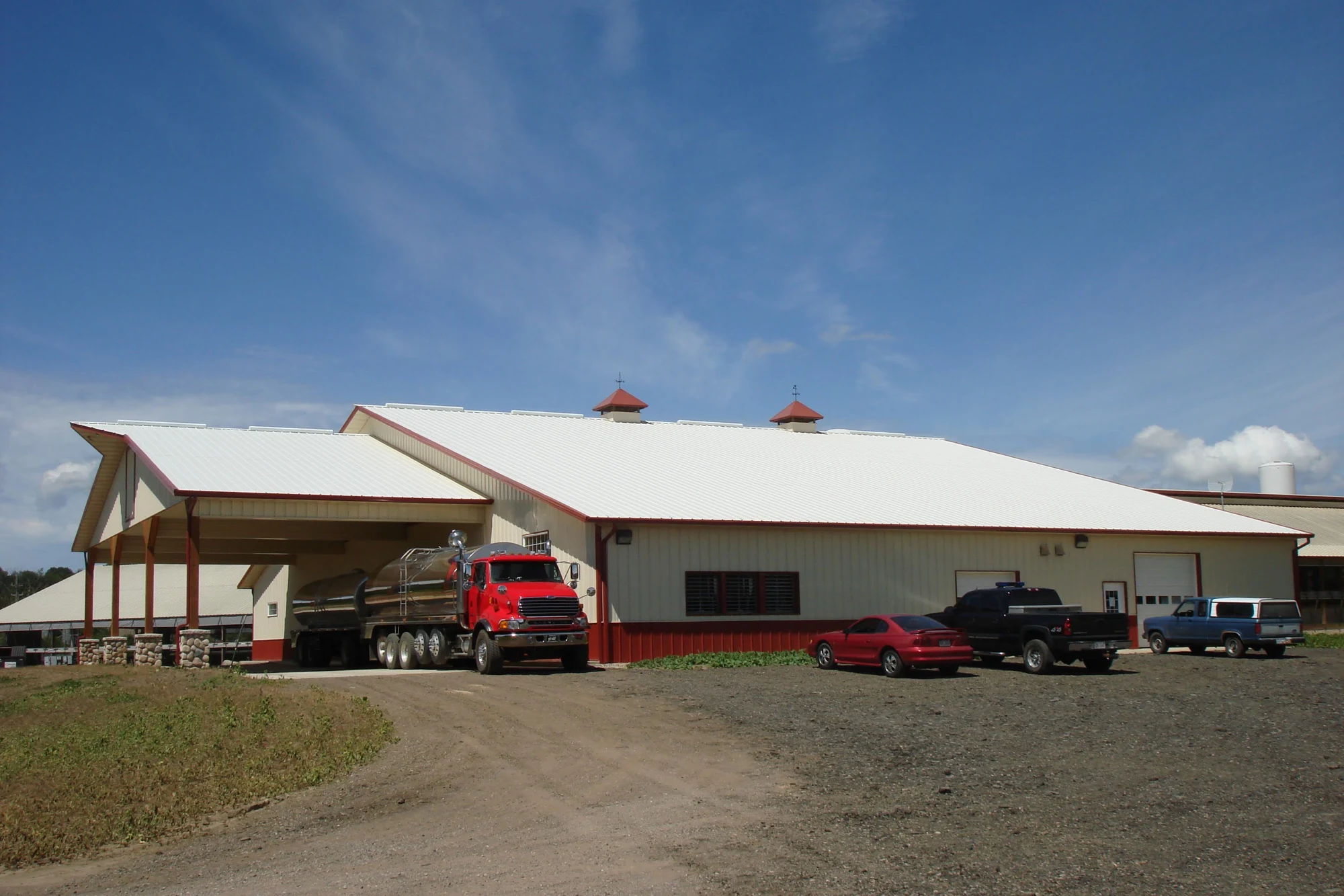 Farm building with covered entrance — project photograph