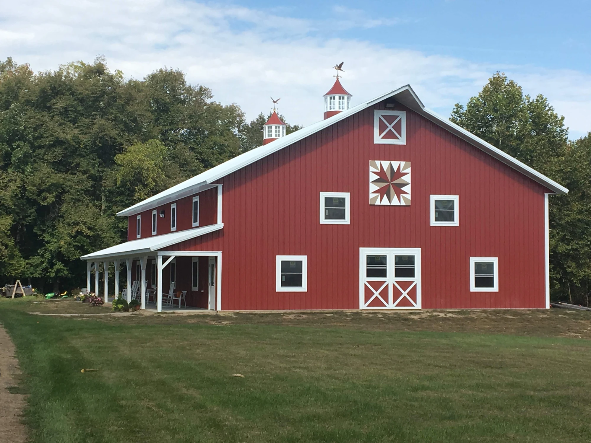 Red barn with covered porch — project photograph